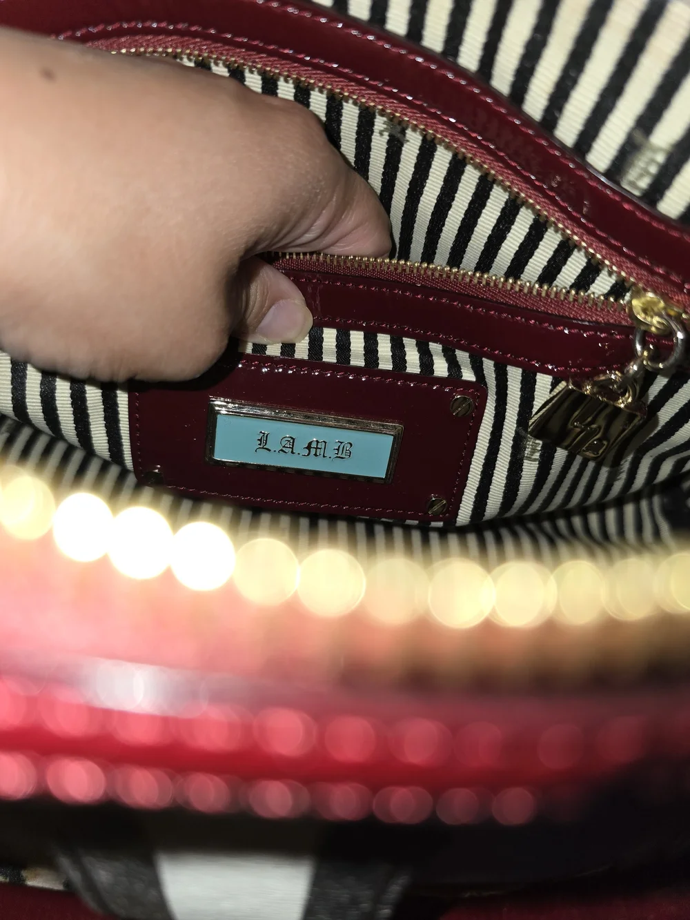 This is a L.A.M.B. by Gwen Stefani monogram Boston bag